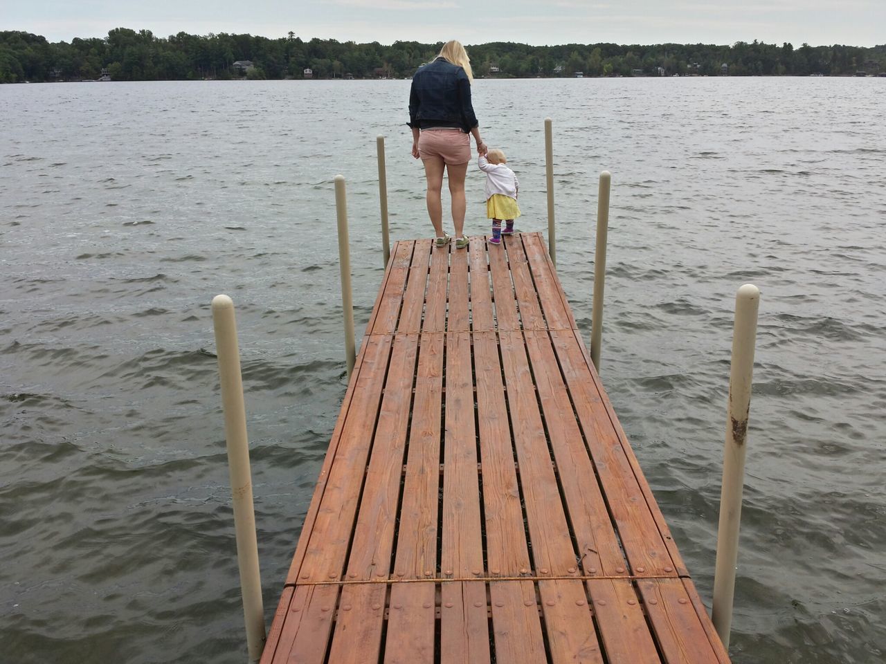 water, pier, rear view, lifestyles, full length, leisure activity, wood - material, the way forward, lake, jetty, standing, tranquility, railing, men, nature, tranquil scene, boardwalk, casual clothing