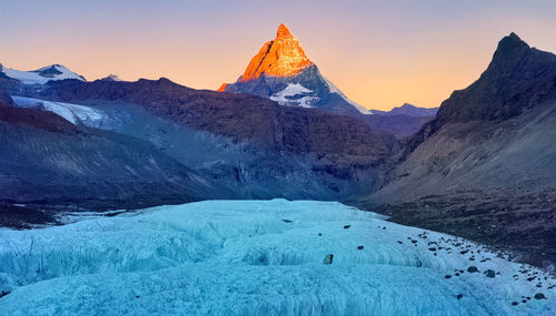 Panoramic view of  snow mountains  with sunset, nordic islands,greenland,faroer,iceland 