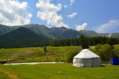 Scenic view of landscape and mountains against sky