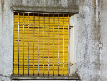 Yellow closed door of building