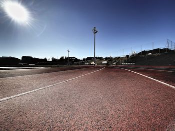 Surface level view of empty road against sky