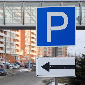 Information sign on road in city