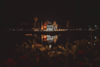 Reflection of buildings in city at night