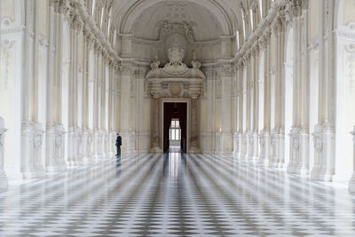 Man walking in historical building