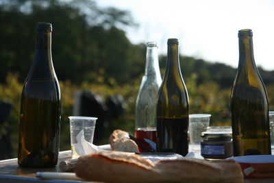 Close-up of wine bottles on table