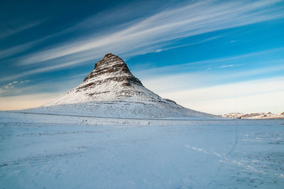 Scenic view of snowcapped mountain against sky