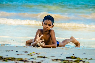 Boy playing on beach