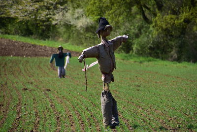 Full length of man standing on field