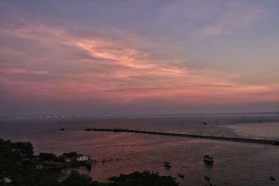 Scenic view of beach against sky during sunset