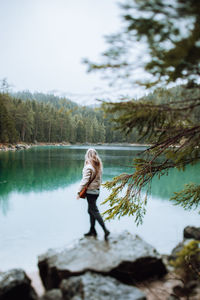 Full length of woman standing in lake