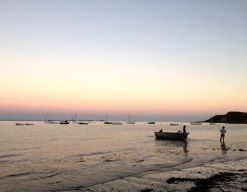 Scenic view of sea against clear sky during sunset