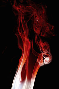 Close-up of fire against black background