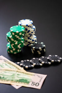 Close-up of coins on table against black background