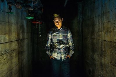 Portrait of man standing at night