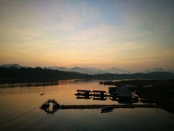 Scenic view of lake against sky during sunset