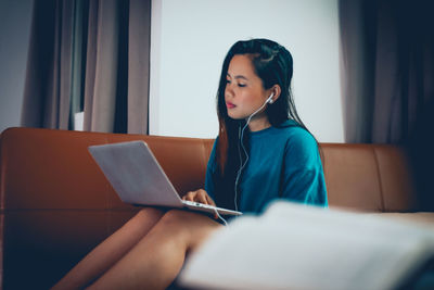 Young woman using mobile phone