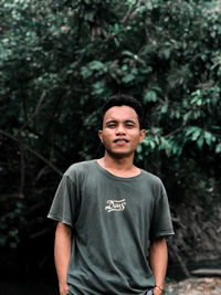 Portrait of young man standing outdoors