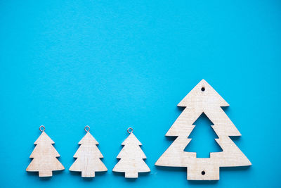 Close-up of blue papers over white background