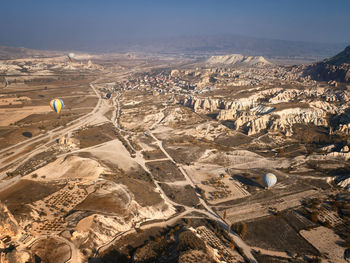 Aerial view of landscape with mountain range in background