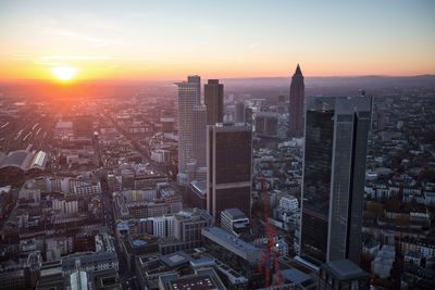 Aerial view of city at sunset