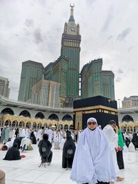 Group of people in temple against buildings