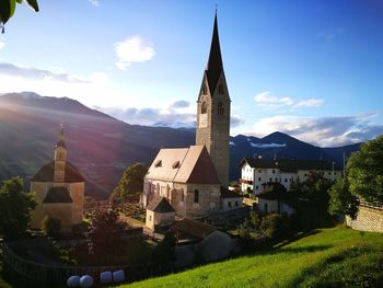 Panoramic view of cathedral and mountains against sky