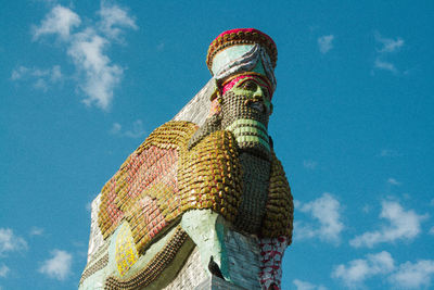 Low angle view of statue against sky