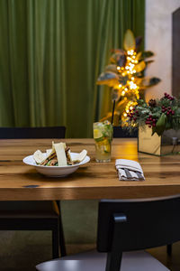 Flower vase on table at home