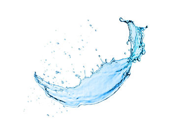 Close-up of splashing water against white background