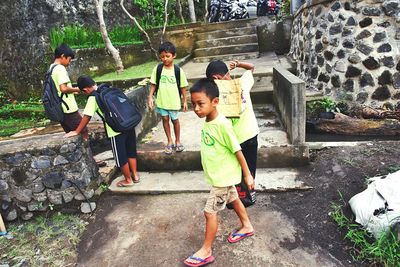 Boy standing on footpath