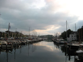 Boats moored at harbor