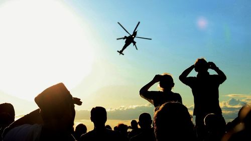 People enjoying at sunset