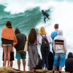 Rear view of people looking at sea