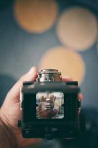 Close-up of hand holding camera