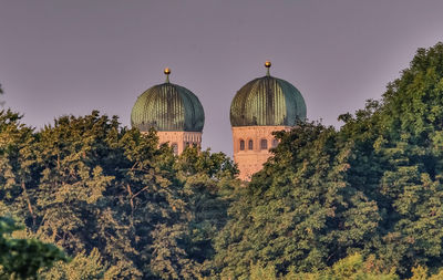 View of trees and buildings against sky