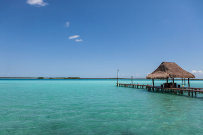 Scenic view of sea against blue sky