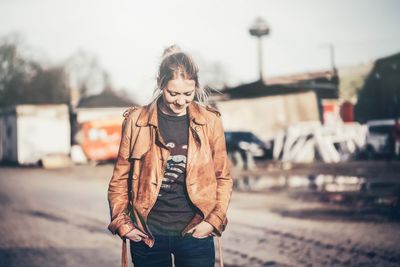 Close-up of woman standing on bench