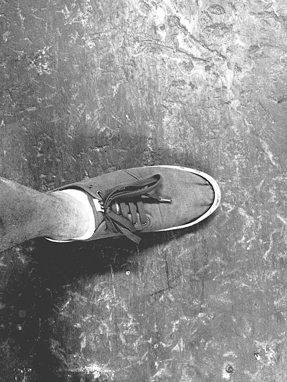 shoe, high angle view, low section, person, footwear, personal perspective, pair, human foot, part of, directly above, day, lifestyles, unrecognizable person, outdoors, canvas shoe, street, men