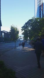 People walking on road in city