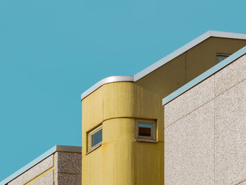 Low angle view of building against blue sky