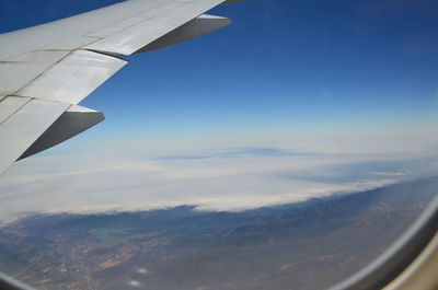 Aerial view of clouds seen from airplane window