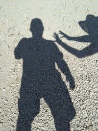 Shadow of people on street