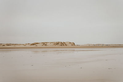 Scenic view of desert against clear sky