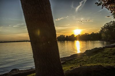 Scenic view of lake at sunset