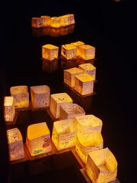 High angle view of multi colored candies against black background