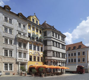 Low angle view of yellow building against sky