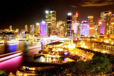 Modern buildings in city at night