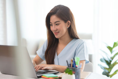 Young woman using mobile phone