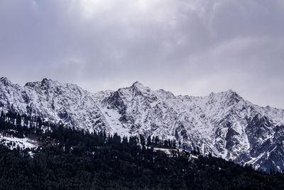 Landscape of mountain range covered with snow in manali during summers. mountain peak in snow.