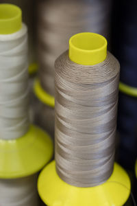 Close-up of gray thread spools